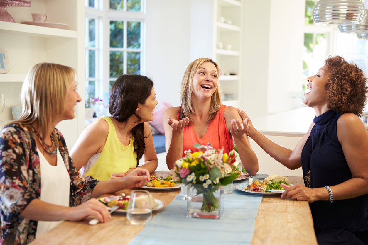 4 ladies eating lunch and laughing