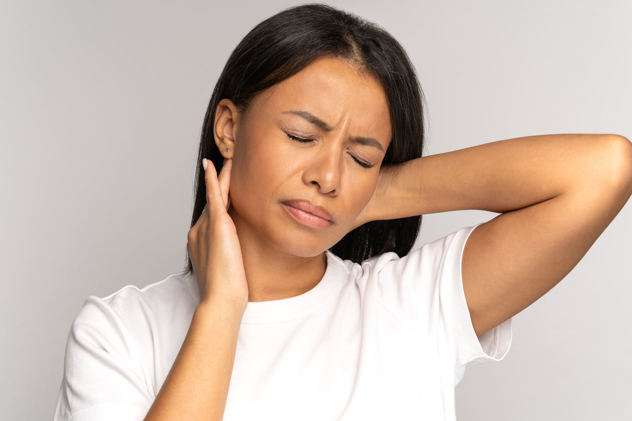 woman with sore neck and headache