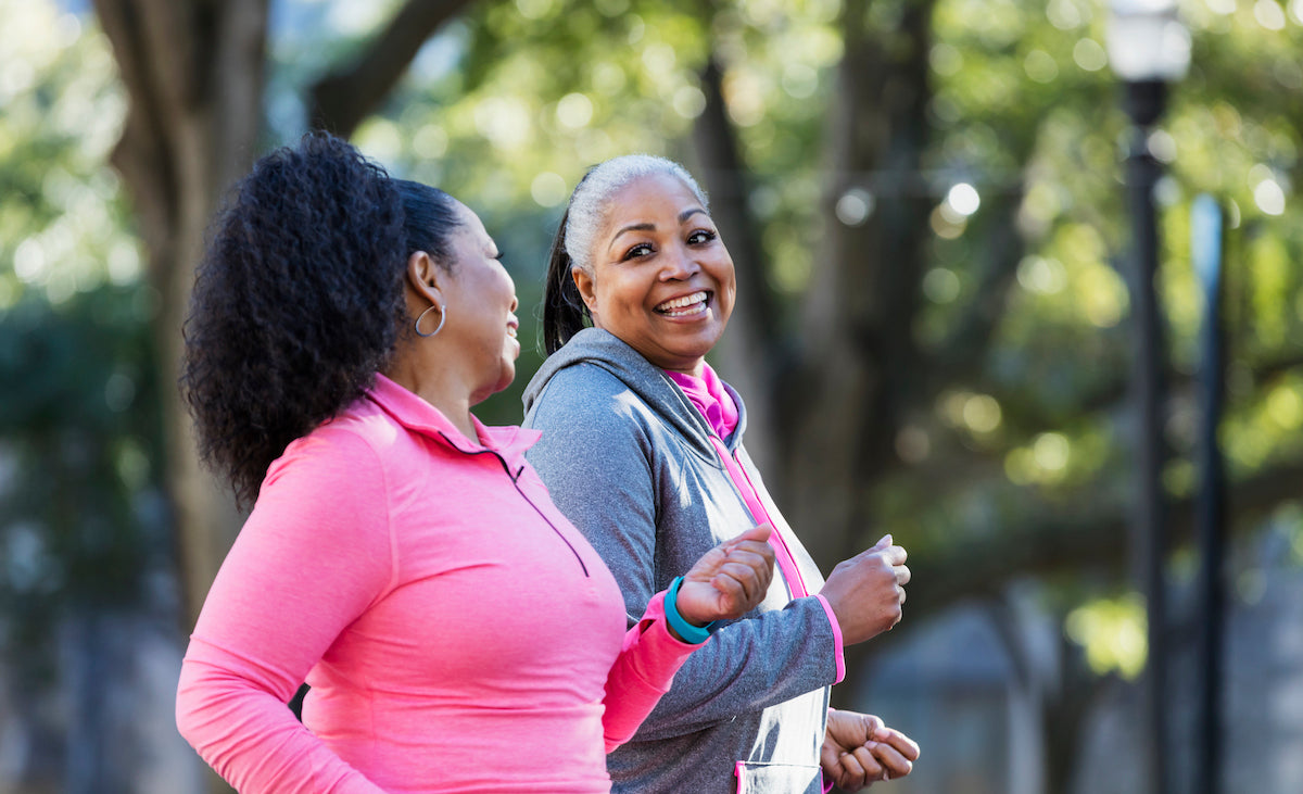 Two, over-50 women walking to keep healthy
